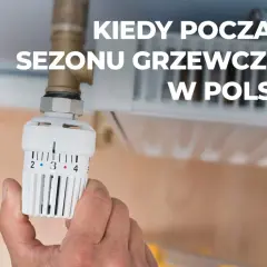 Dłoń reguluje termostat grzejnika. Kiedy rozpoczyna się sezon grzewczy w Polsce?